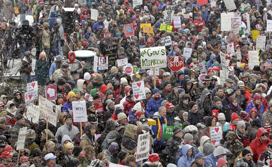 In 2011, thousands protested outside Wisconsin's Capitol building, opposing Walker's bill to eliminate collective bargaining rights for many state workers.