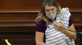 In this Aug. 31, 2020, file still image from California State Assembly video, Assemblywoman Buffy Wicks, a Democrat from Oakland, addresses lawmakers while holding her one-month-old daughter Elly in her arms during the final hours of the California legislative session in Sacramento, Calif. 