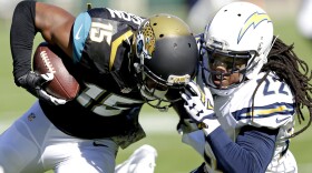 Jacksonville Jaguars wide receiver Allen Robinson (15) is tackled by San Diego Chargers cornerback Jason Verrett (22) after a reception during the first half of an NFL football game in Jacksonville, Nov. 29, 2015. 
