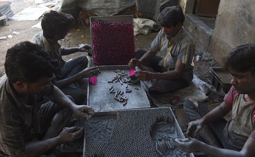 Workers in India prepared firecrackers at a workshop on the outskirts of Ahmedabad last month, ahead of the Diwali festival that peaks on Oct. 19.
