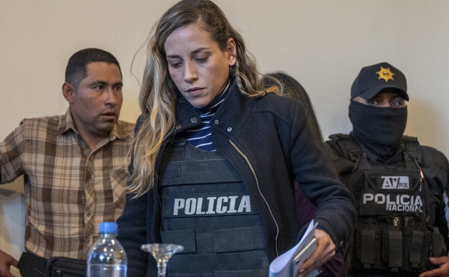 Wearing a bulletproof vest, Andrea Gonzalez, the running mate of slain presidential candidate Fernando Villavicencio, arrives for a press conference in Quito, Ecuador, Thursday, Aug. 10, 2023.