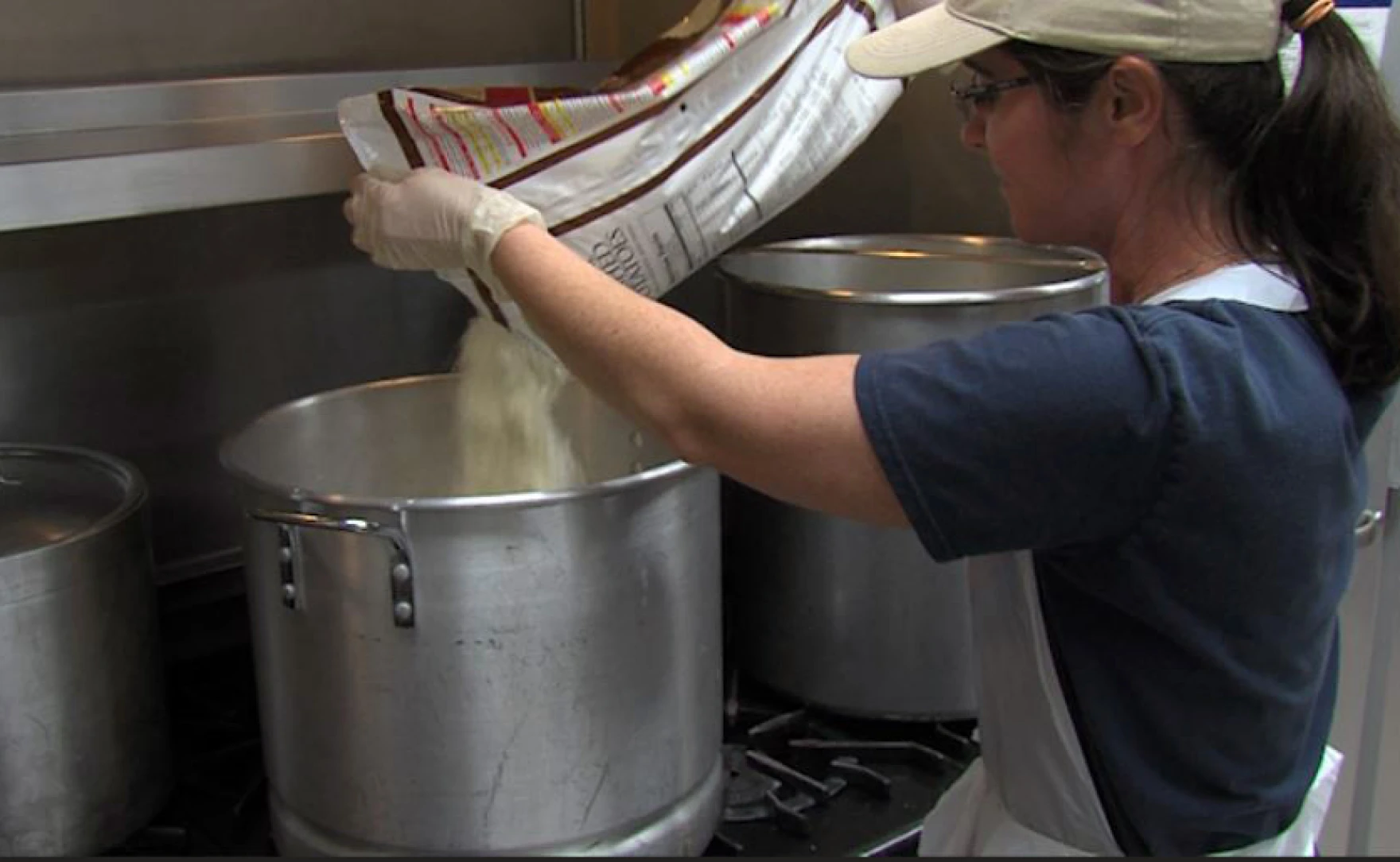 A volunteer helps prepare dinner at Saint Brigid Parish in Pacific Beach, January 8, 2018.