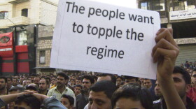 In this citizen journalism image made on a mobile phone and acquired by the AP, Syrians protest against the regime of President Assad, in the coastal town of Banias, Syria, on Thursday.