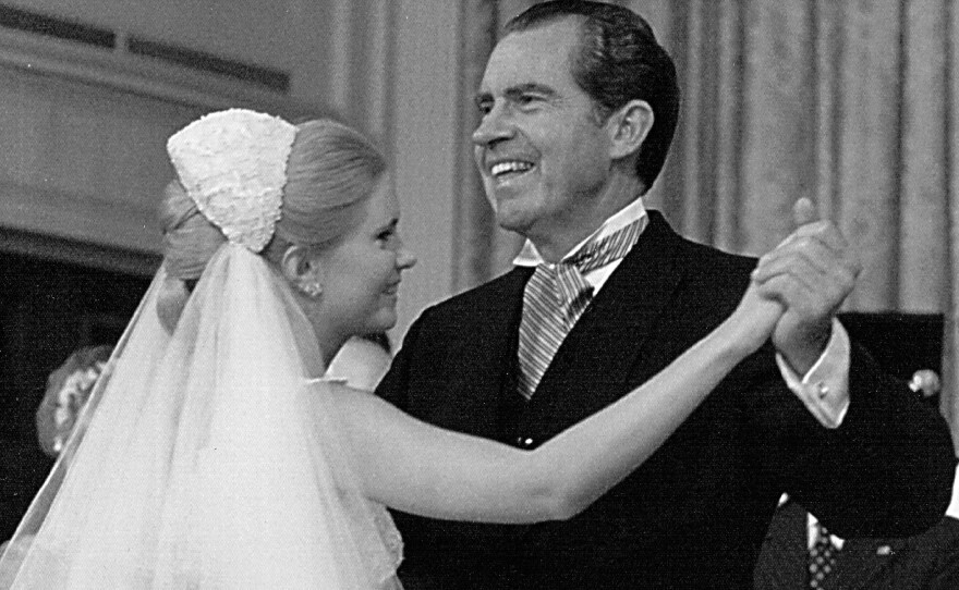 President Richard Nixon dances with his daughter, Tricia, during her wedding reception on June 12, 1971 at the White House.