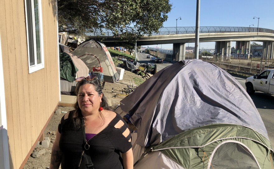 Anita DeAsis says she was evicted from her Oakland home last year, and now lives in a camper with her two young children.