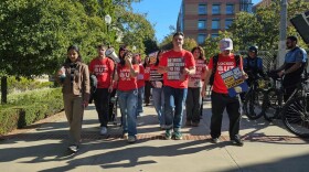 Dozens of UC students march outside a meeting of the University of California Board of Regents in Los Angeles to protest the system’s plan to continue annual tuition increases on Nov. 19, 2025.