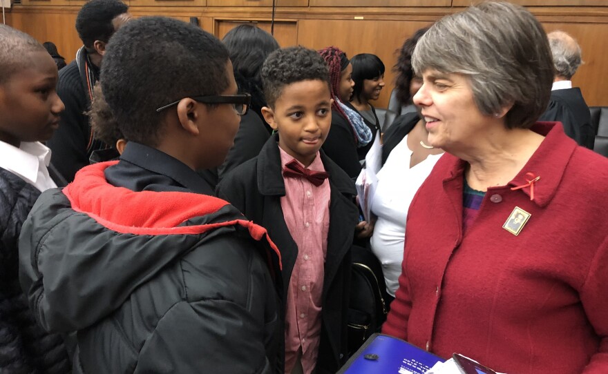 Muhanad Osman and Zebasil Ayalew, seventh-graders at the School Without Walls, talking with Tinker.