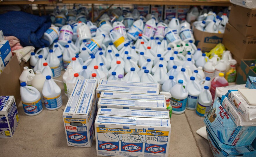 Containers of donated cleaning supplies, kitty litter and other necessities occupy one area of the shelter.