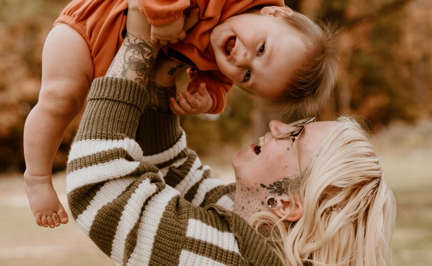 Sierra Smith holds her son, Travis, whose deafness was successfully treated with gene therapy.