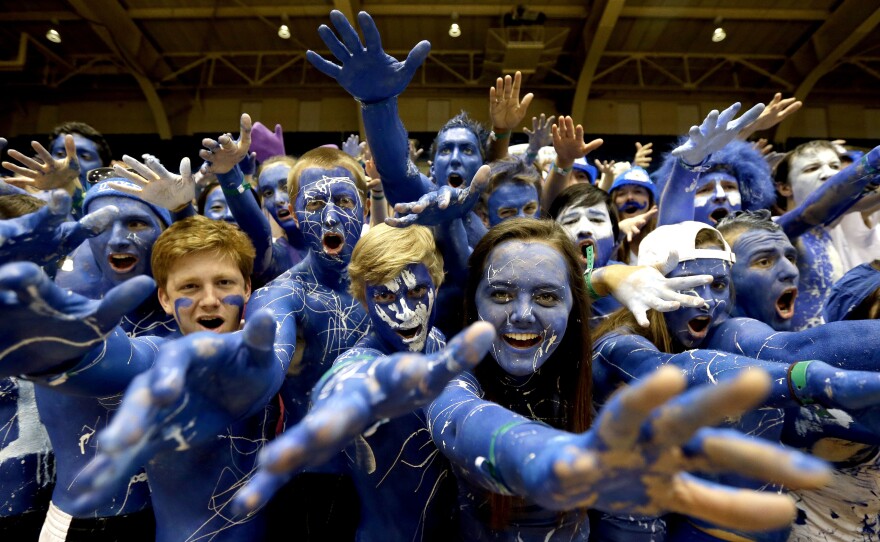 Duke fans cheer prior to the tip-off between Duke and North Carolina in an NCAA college basketball game in Durham, N.C., on March 8, 2014.