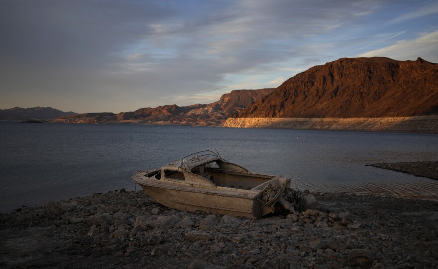 A formerly sunken boat sits high and dry along the shoreline of Lake Mead at the Lake Mead National Recreation Area, on May 10, near Boulder City, Nev.