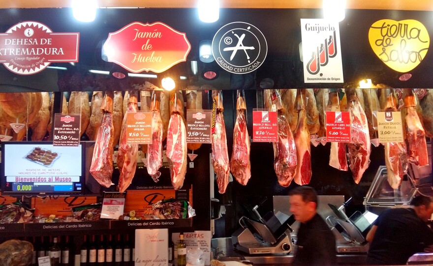Spanish hams hang from the ceiling at Museo del Jamón, a ham bar in downtown Madrid.