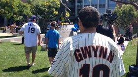Fans pay tribute to Tony Gwynn near his statue at Petco Park, June 16, 2014.