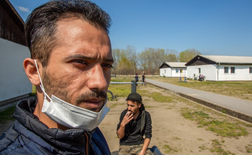 Mohammad al-Muhammad (left) and Hatem al-Hamad in the Krnjaca asylum center in Serbia. Muhammad fled his home in Syria and managed to cross into Romania in December. He says he lost 85% of his eyesight after Romanian police caught him and beat him with a truncheon on his right eye and sent him back to Serbia.