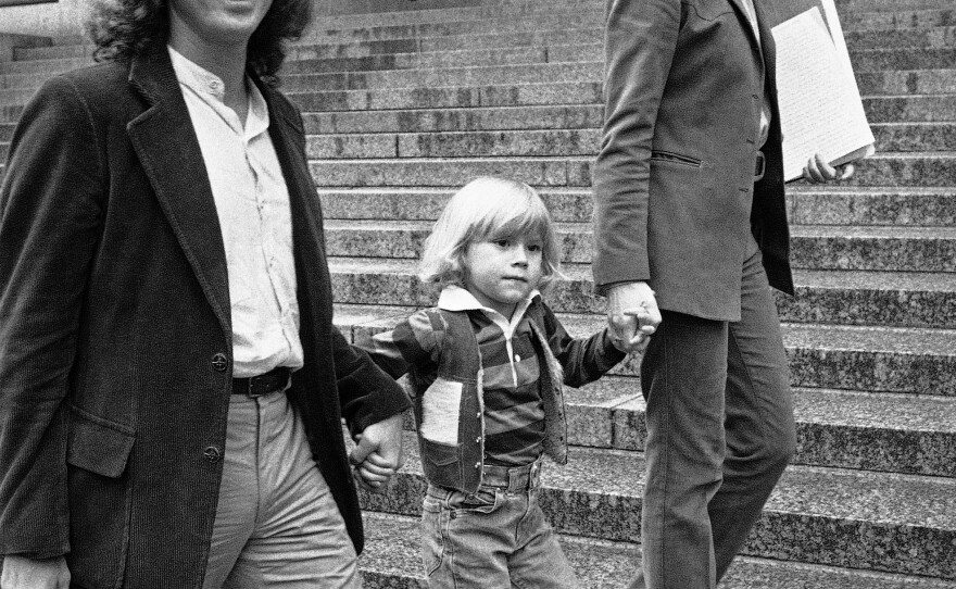 Zayd Ayers Dohrn walks with his parents Bill Ayers and Bernardine Dohrn outside the Federal Court Building in New York, May 17, 1982.