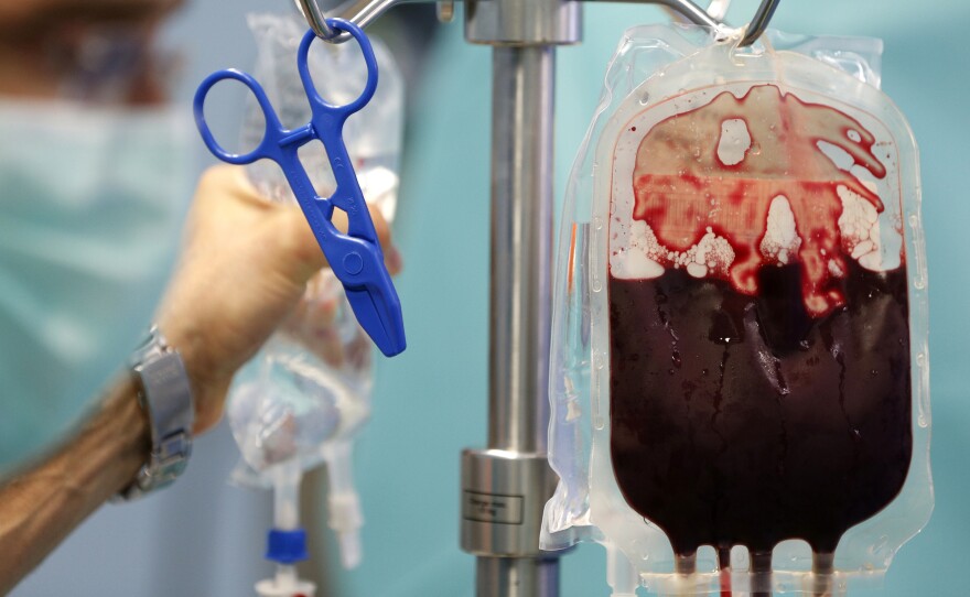 A blood transfusion bag hangs in an operating room in a hospital in the Republic of Congo. Most countries in sub-Saharan Africa have a huge gap between blood supply and demand, new research found.
