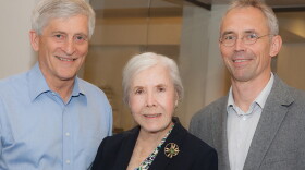 Helen Dorris, center, stands with Ulrich Mueller, right, and Jim Paulson in this undated photo.