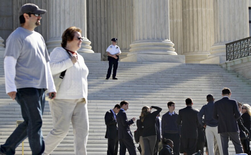 <p>As visitors lined up outside the Supreme Court on Wednesday, the justices grappled with the question of when churches might be exempt from certain federal laws. </p>