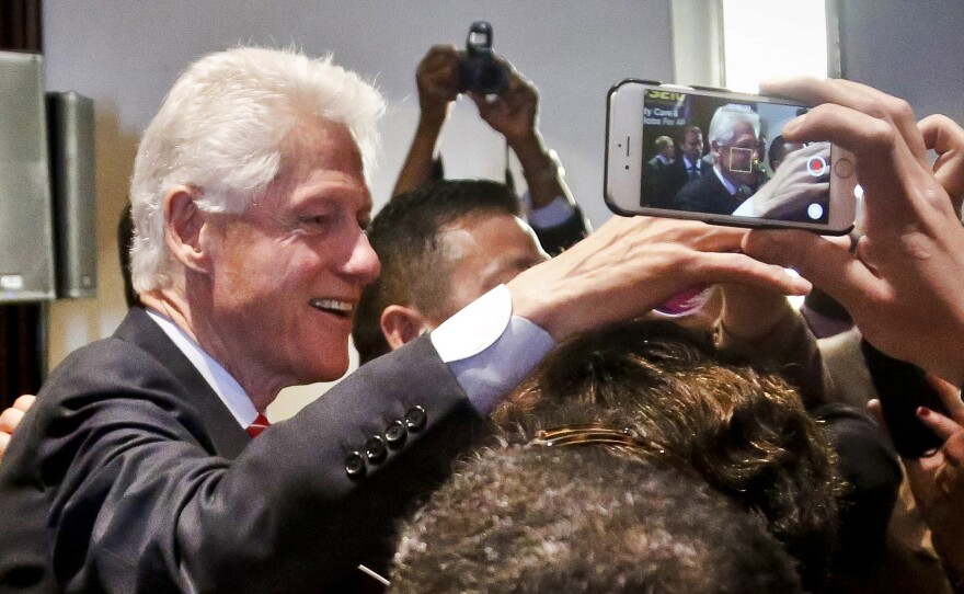 Former President Bill Clinton meets members of the 1199 health care union after speaking to the group during a campaign stop for Hillary Clinton in New York last month.