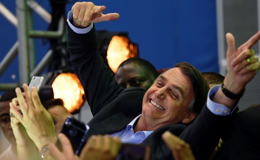 Brazilian lawmaker Jair Bolsonaro is greeted by supporters as he launches his campaign for October's presidential election, in Rio de Janeiro, on July 22.
