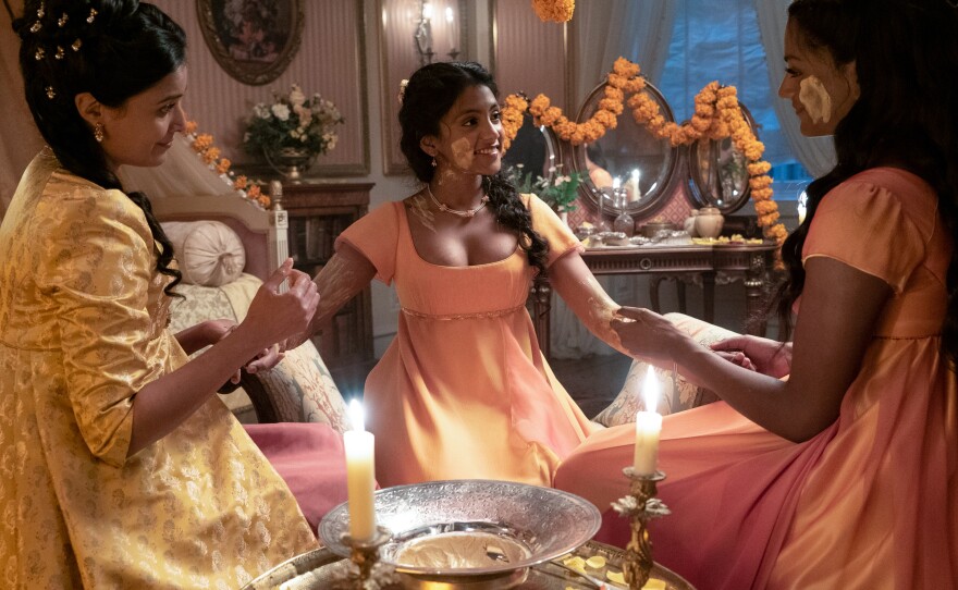 Mary Sharma (Shelley Conn) eloped with an Indian tradesman and left her native England. Now she's back, a widow hoping to find support from her estranged family — and a husband for daughter Edwina (center). The show's depiction of Indian fashion has earned praise although fans are quick to point out cultural inaccuracies.