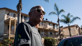 Brian Pollard with the Urban Collaborative Project, a San Diego nonprofit, walks around a southeastern San Diego community on Jan. 11, 2017 where he says new residents have made once primarily African-American areas more diverse.