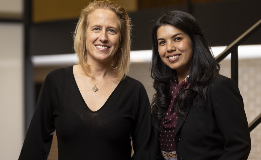 Rebecca Ford-Paz (left), a child psychologist at Lurie Children's Hospital, and Aimee Hilado, an social work professor at the University of Chicago, are leading a program that trains front-line workers in city-run shelters to form informal support groups for migrants, called <em>Café y Comunidad charlas — </em>coffee and community talks.