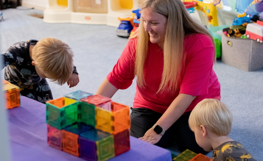 Jennifer Williams plays with her sons at home. She said leaving her job to care for her sons was a difficult call to make, but it was the right one for her family.