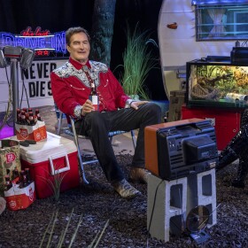 Joe Bob Briggs and Darcy the Mail Girl on the set of Shudder's "The Last Drive-In." Undated photo.