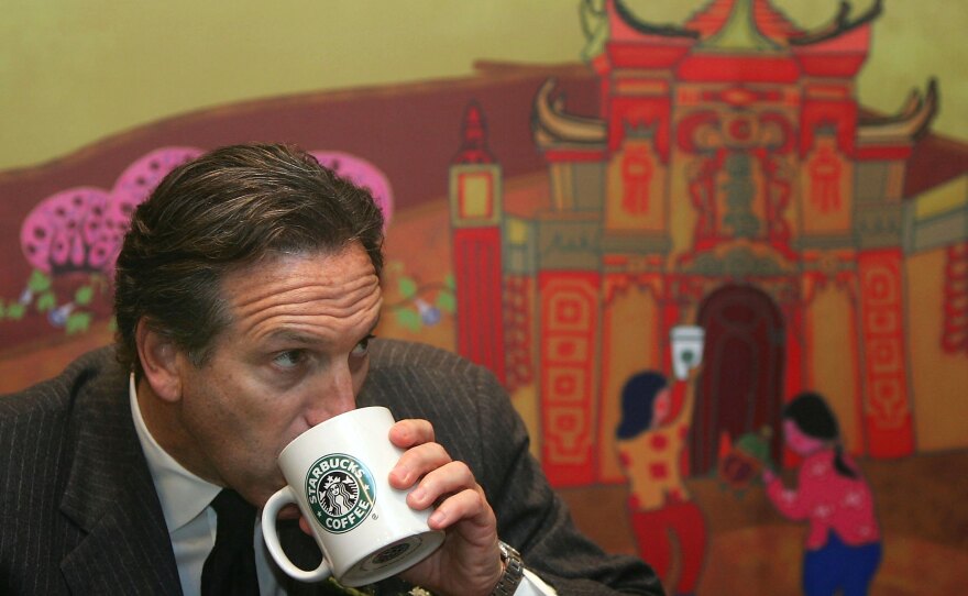 Howard Schultz sips coffee in Chongqing, China, in 2006. Schultz, who grew Starbucks into the global brand it is today, returns to the company as interim CEO after Kevin Johnson's departure.