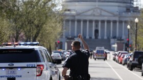 Law enforcement and rescue vehicle are seen on a street leading to Capitol Hill in Washington after reports of gunfire at the Capitol Visitor Center complex, March 28, 2016.