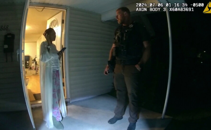 FILE - In this image from body camera video released by Illinois State Police, Sonya Massey, left, talks with Sangamon County Sheriff's Deputy Sean Grayson outside her home in Springfield, Ill., July 6, 2024.