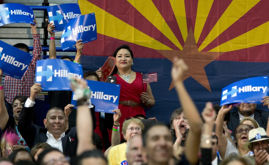 People in the audience cheer as Democratic presidential candidate Hillary Clinton speaks during a campaign event at a high school in Phoenix in March 2016 ahead of the Arizona primary.