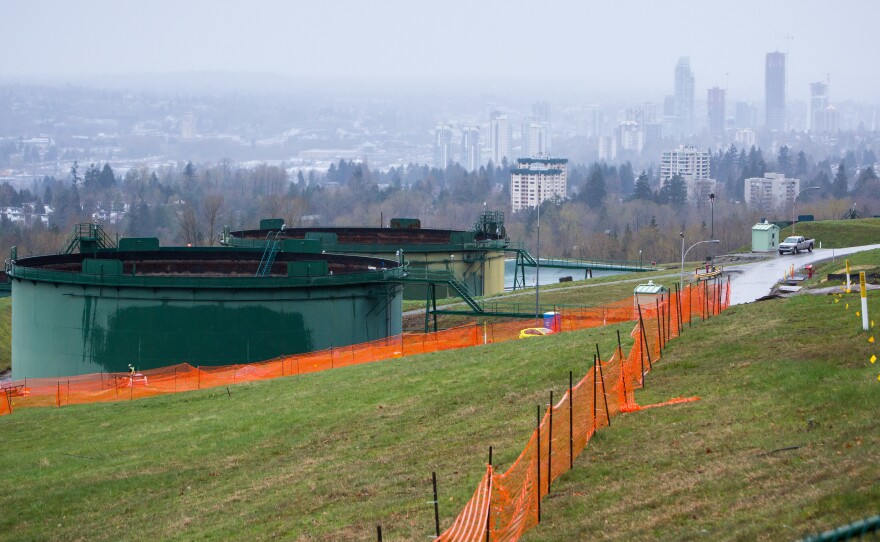 Oil tanks stand near the Trans Mountain pipeline expansion site in Burnaby, British Columbia, in April. The Canadian government bought the project in an effort to ensure it goes forward as the summer construction season nears.