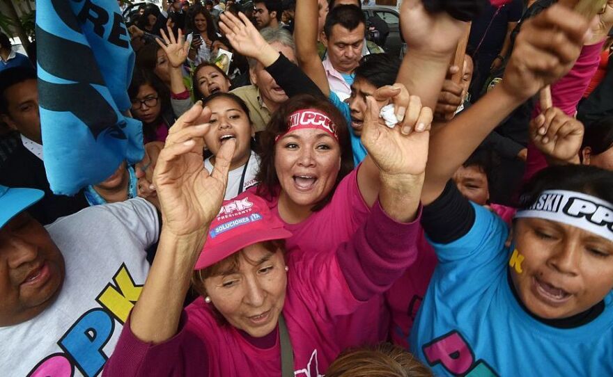 Supporters of Peru's President-elect Pedro Pablo Kuczynski cheer during his victory announcement in Lima on Thursday.