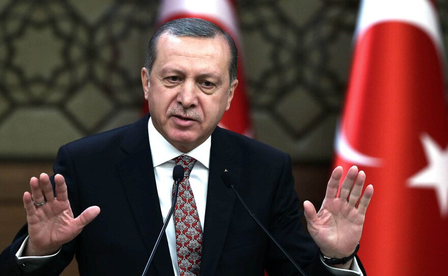 Turkish President Recep Tayyip Erdogan, shown here on Feb. 10 at his Ankara palace, remains popular with conservative and religious Turks, while his critics face a growing crackdown.