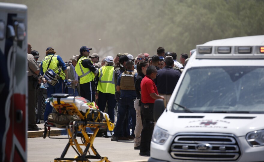 Emergency personnel gather near Robb Elementary School following a shooting Tuesday, May 24, 2022, in Uvalde, Texas. Nineteen children and two adults were shot and killed.