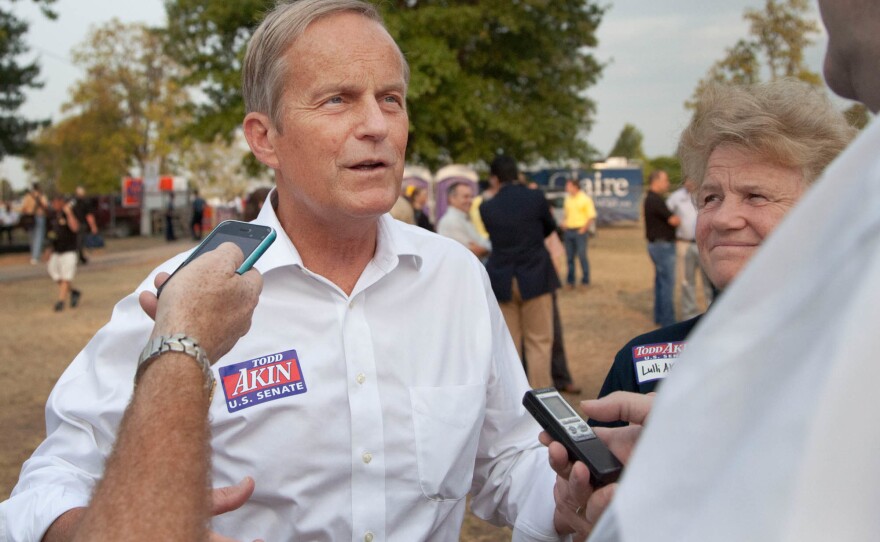 In this Aug. 16, 2012 photograph, former Rep. Todd Akin, R-Mo., and his wife Lulli, talk with reporters while attending the Governor's Ham Breakfast at the Missouri State Fair in Sedalia, Mo.