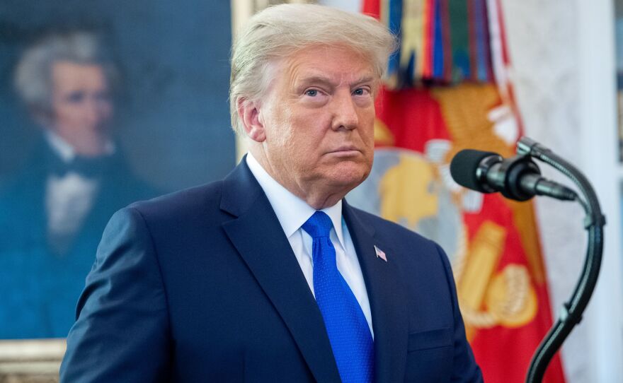 President Trump threatened a hard-fought relief bill passed by Congress, calling it "a disgrace" in a video released on Twitter on Tuesday evening.