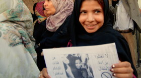 Nujood Ali, a former child bride in Yemen, demonstrates outside parliament in San'a, Yemen, on March 23 in support of proposed legislation banning the marriage of girls under 17. Ali was granted a historic divorce in 2008 at age 9 after her impoverished father forced her into an arranged marriage with a man 20 years older.