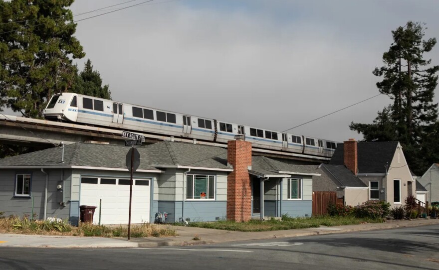 A BART train runs above single-family homes in Albany on July 22, 2019.