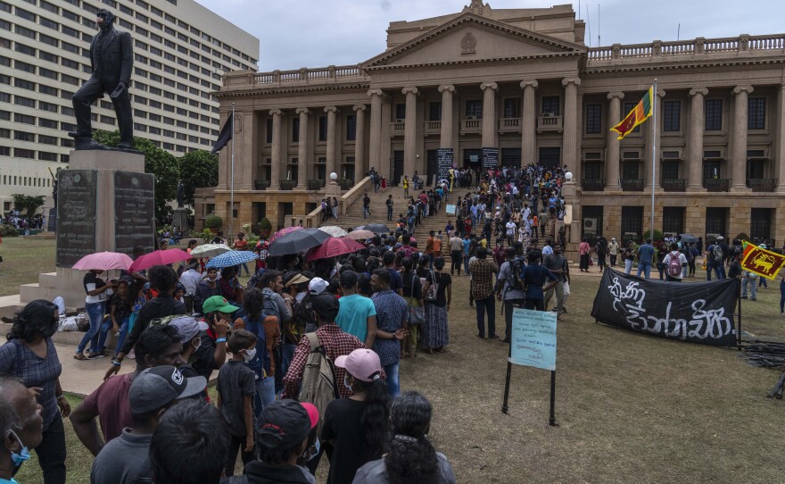 People queue up to visit President Gotabaya Rajapaksa's office for the second day after it was stormed in Colombo, Sri Lanka, on Monday.