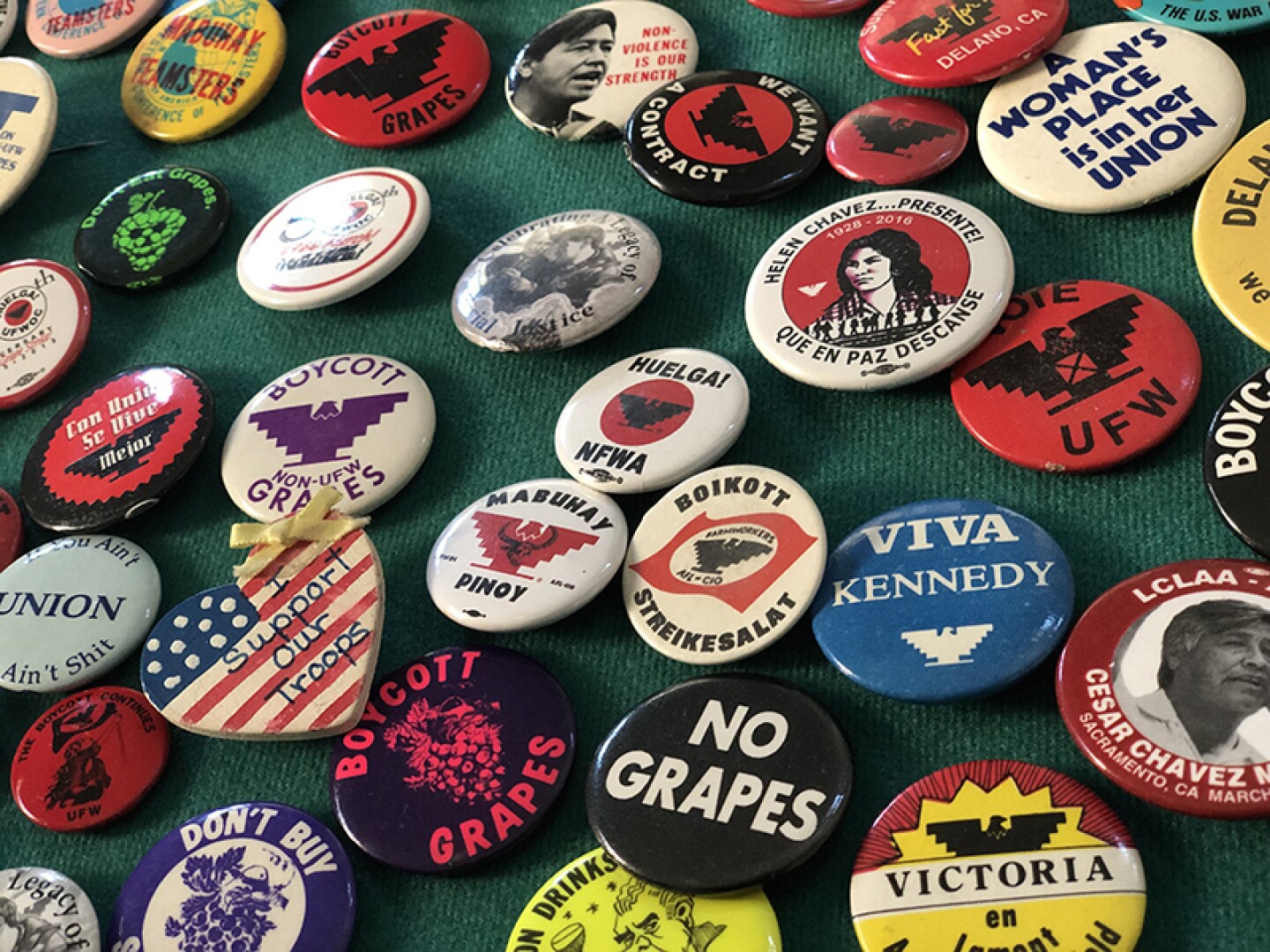 Pins from Lorraine Agtang's private collection re: Delano Strike of Filipino American grape workers and more.