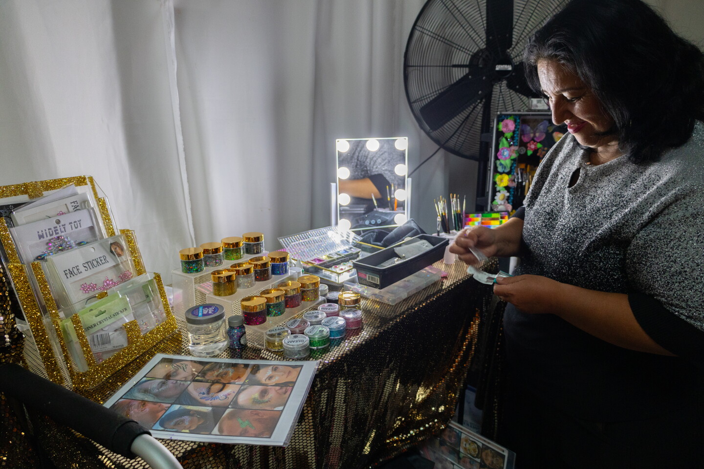 A hired face painter paints guests at Asiya Nero's quinceañera on May 30, 2026.