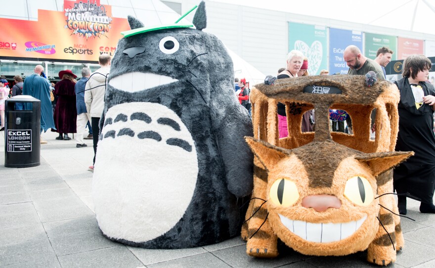 Totoro and the Catbus, the forest king's preferred mode of transportation, on display at a London comics convention in 2016.