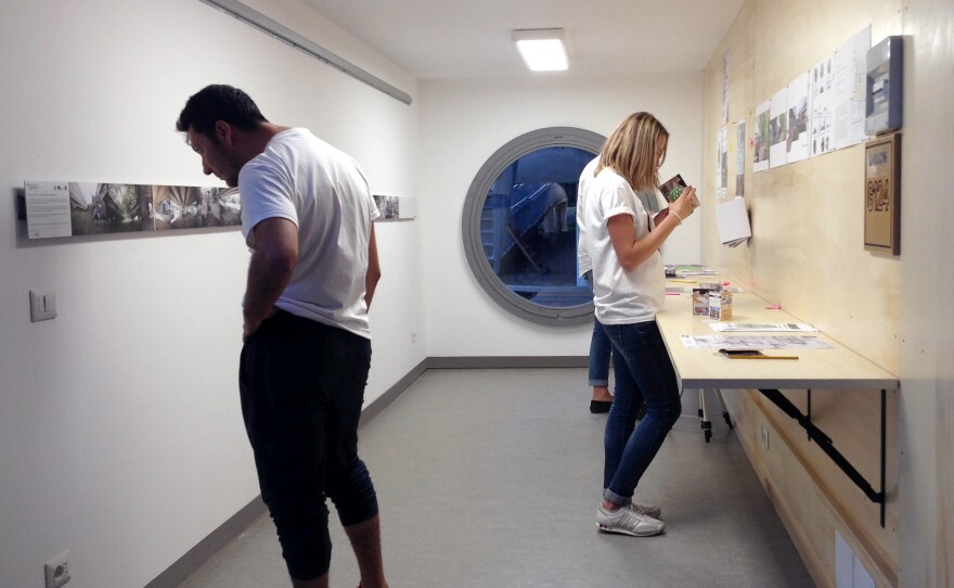A community center and workshop is housed inside a shipping container.
