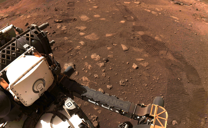 An image captured by the navigation cameras of NASA's Perseverance rover shows tracks on the surface of Mars during the rover's first test drive on March 4.