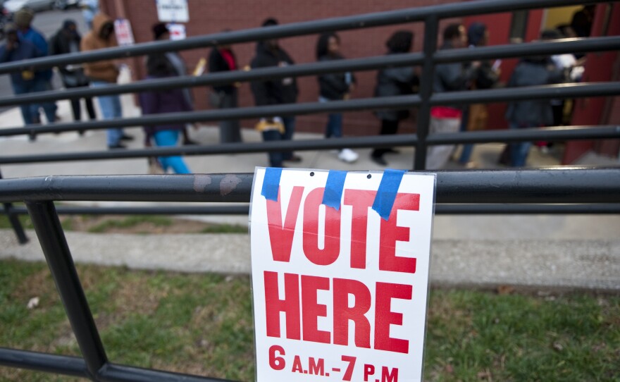 Voters wait in line to cast their ballots at Cleveland Avenue Baptist Church in Kansas City, Mo., on Nov. 6, 2012.