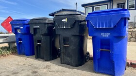 Trash and recycling bins sit curbside in Ocean Beach, Sept. 17, 2025.