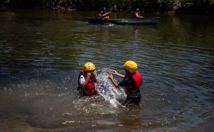 Students of the Migrant Outdoor Education Program canoe along the San Joaquin River near the Scout Island Education Center in Fresno on July 11, 2025.